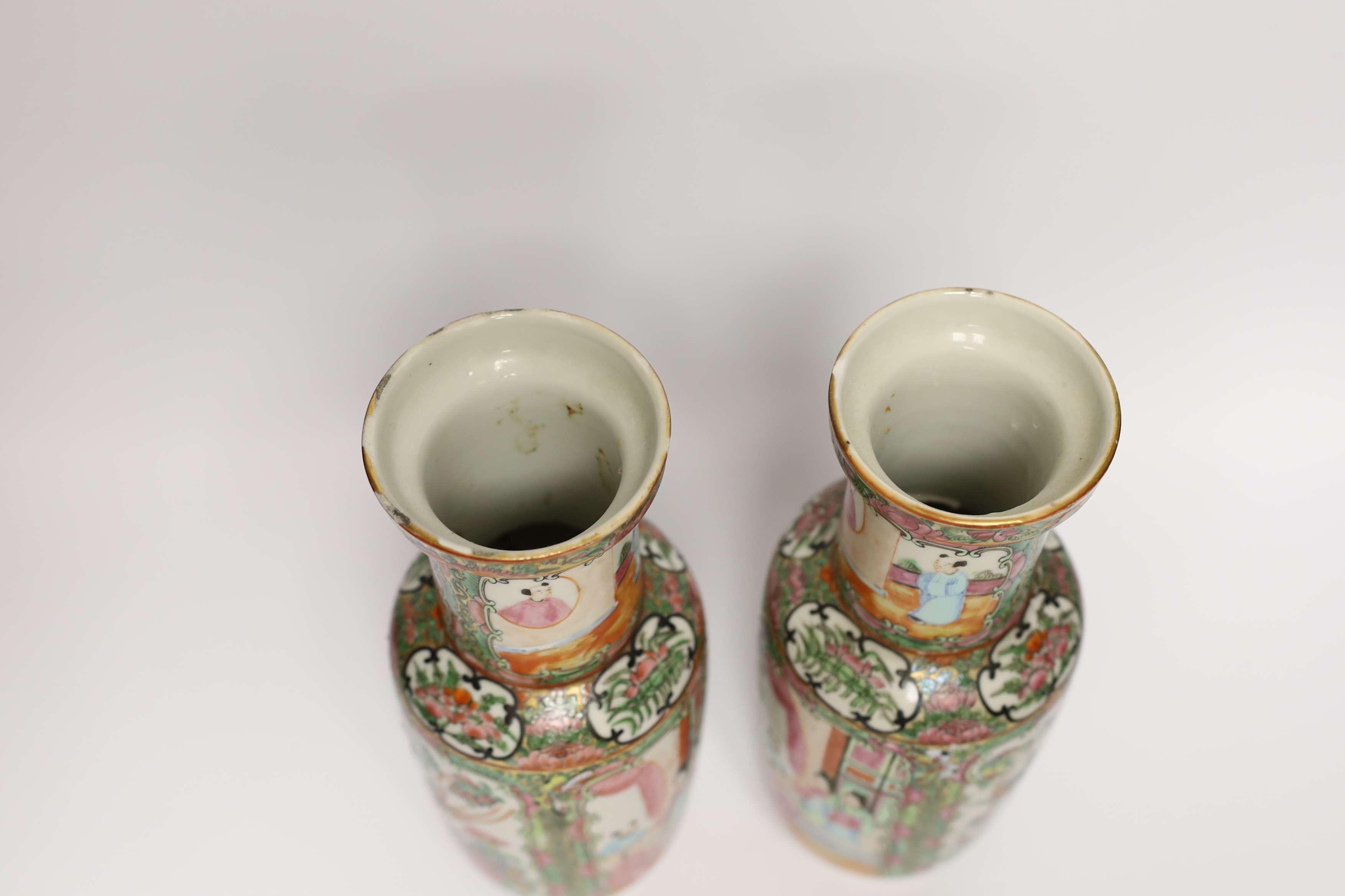 A pair of early 20th century Chinese famille rose vases, 26cm high